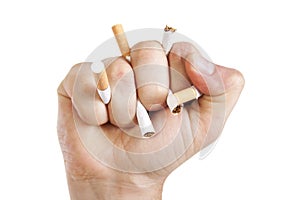 ManÃ¢â¬â¢s hand crushing cigarettes